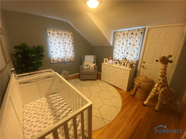 2950 Darlington Rd, Toledo, OH 43606 - bedroom with light wood-style flooring and lofted ceiling