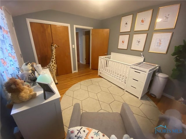 2950 Darlington Rd, Toledo, OH 43606 - bedroom featuring light wood finished floors and vaulted ceiling