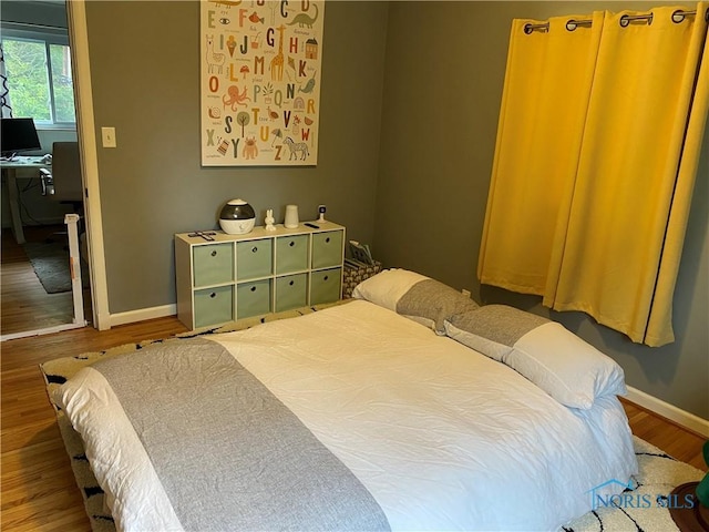 2950 Darlington Rd, Toledo, OH 43606 - bedroom with wood finished floors and a desk