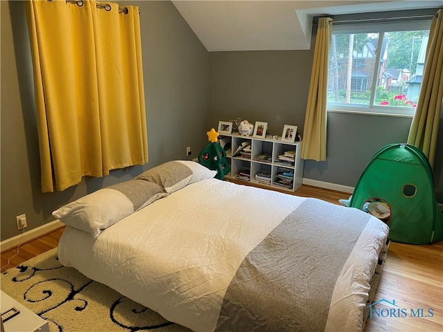 2950 Darlington Rd, Toledo, OH 43606 - bedroom featuring wood finished floors and vaulted ceiling