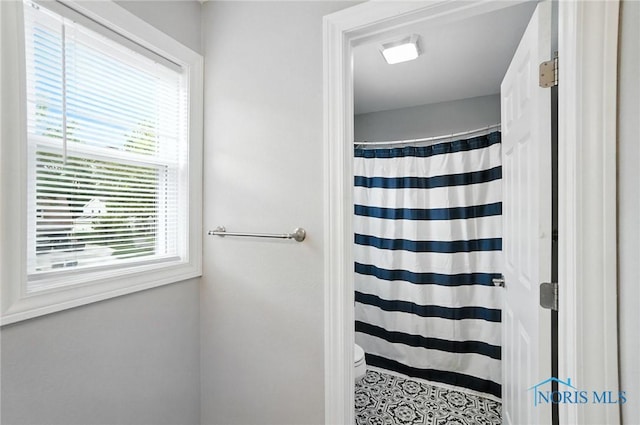 845 Oak Knoll Dr, Perrysburg, OH 43551 - bathroom featuring toilet and curtained shower