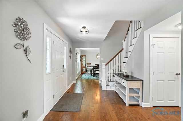 845 Oak Knoll Dr, Perrysburg, OH 43551 - foyer with dark wood-style floors and stairway
