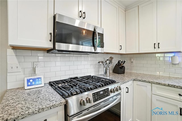 845 Oak Knoll Dr, Perrysburg, OH 43551 - kitchen with stainless steel appliances and white cabinets