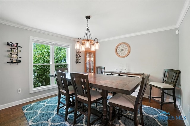 845 Oak Knoll Dr, Perrysburg, OH 43551 - dining area with crown molding, a chandelier, and wood finished floors