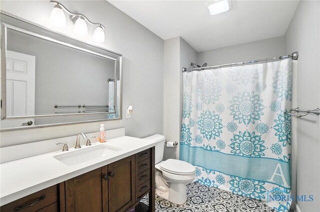 845 Oak Knoll Dr, Perrysburg, OH 43551 - bathroom with vanity, curtained shower, and tile patterned floors