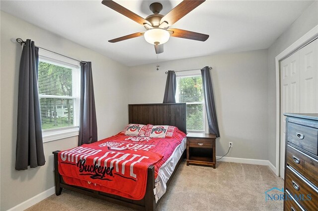 845 Oak Knoll Dr, Perrysburg, OH 43551 - carpeted bedroom with baseboards and a ceiling fan
