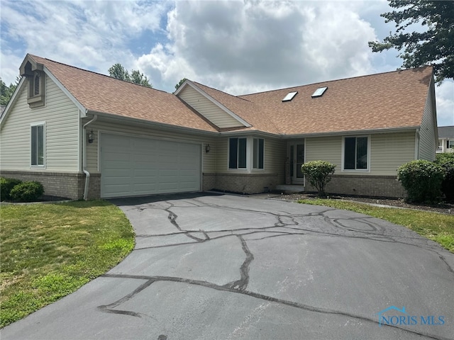 4125 Meadow Green Dr, Sylvania, OH 43560 - ranch-style house with brick siding, asphalt driveway, a garage, and a shingled roof