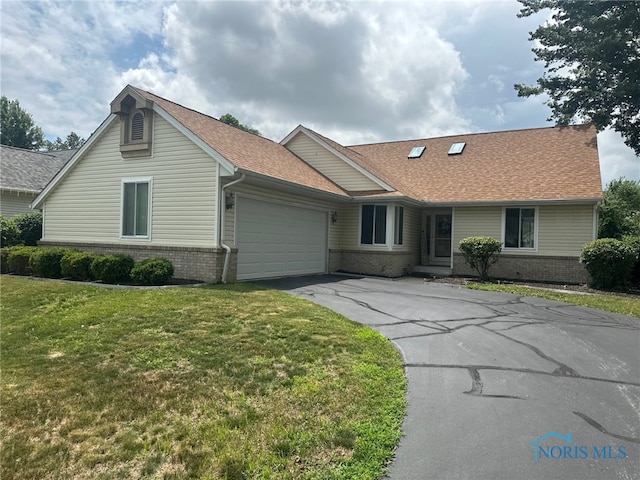 4125 Meadow Green Dr, Sylvania, OH 43560 - ranch-style home featuring brick siding, asphalt driveway, an attached garage, a front lawn, and a shingled roof