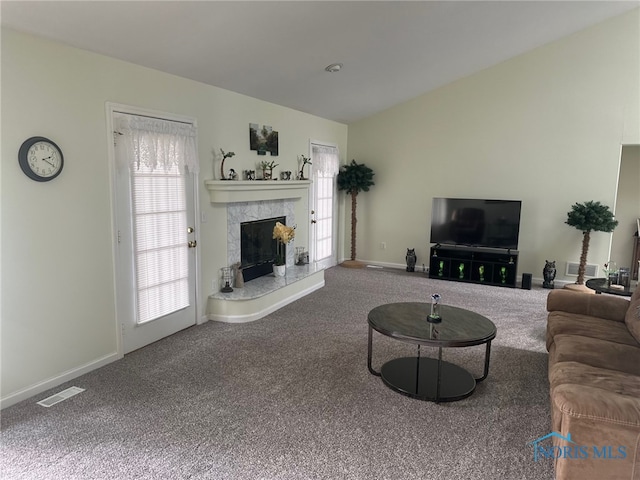 4125 Meadow Green Dr, Sylvania, OH 43560 - living area with carpet, vaulted ceiling, and a fireplace