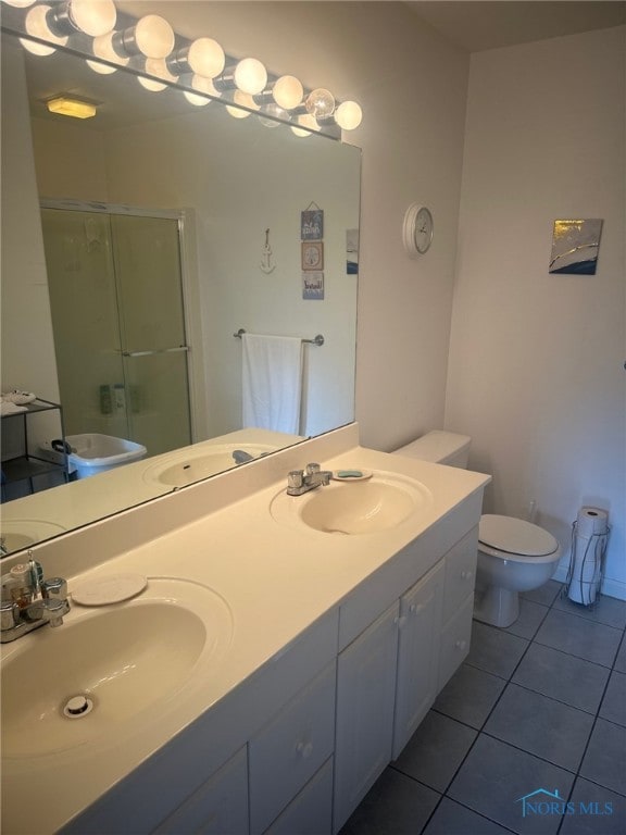 4125 Meadow Green Dr, Sylvania, OH 43560 - full bath featuring tile patterned flooring, a stall shower, and double vanity