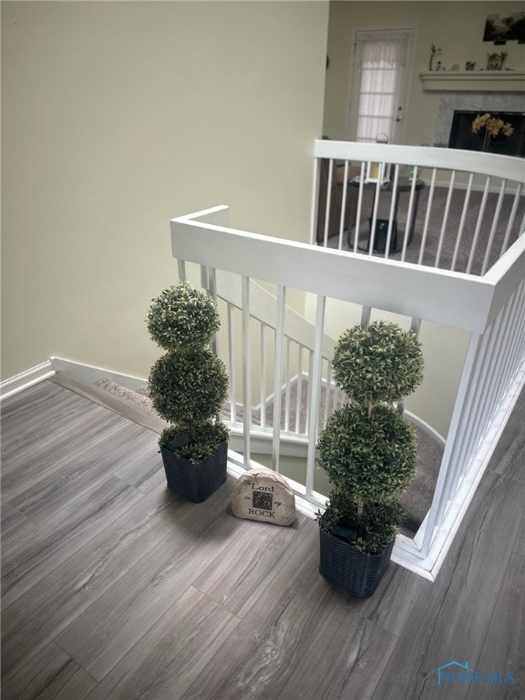 4125 Meadow Green Dr, Sylvania, OH 43560 - stairs with wood finished floors and baseboards
