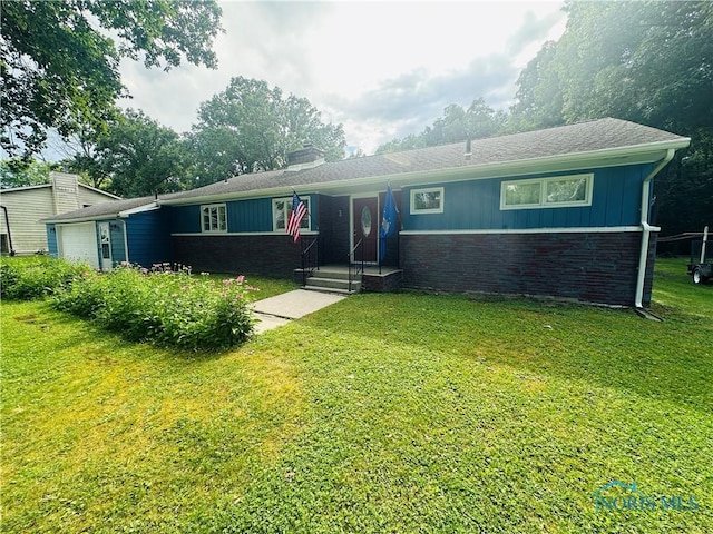 714 Westwood Dr, Defiance, OH 43512 - single story home with brick siding, a garage, board and batten siding, a front yard, and a chimney