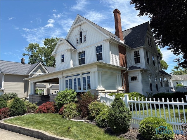 643 S Clinton St, Defiance, OH 43512 - victorian home featuring a chimney