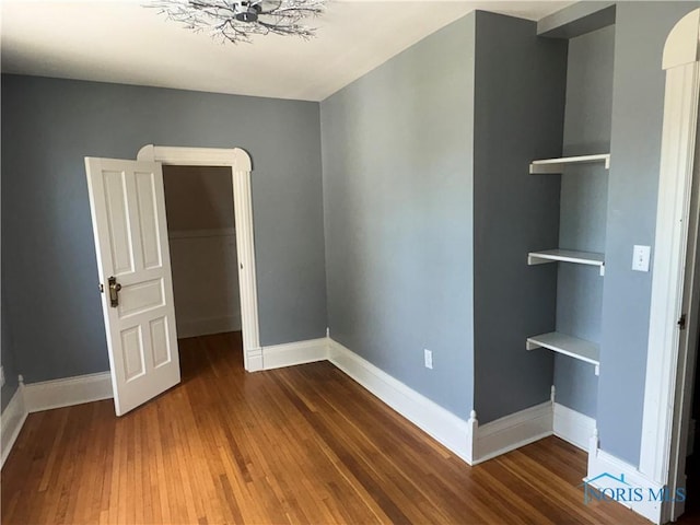 643 S Clinton St, Defiance, OH 43512 - unfurnished room with wood finished floors and baseboards
