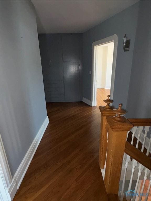 643 S Clinton St, Defiance, OH 43512 - corridor featuring wood finished floors and an upstairs landing