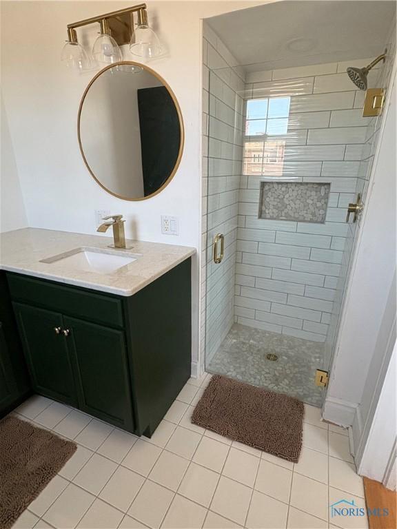 643 S Clinton St, Defiance, OH 43512 - bathroom featuring a stall shower, vanity, and tile patterned flooring