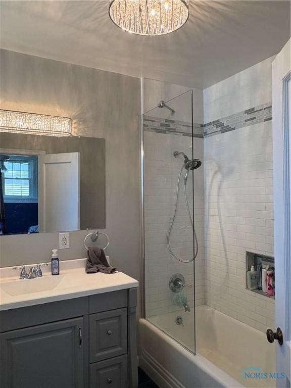 643 S Clinton St, Defiance, OH 43512 - bathroom with vanity, bathtub / shower combination, and a chandelier