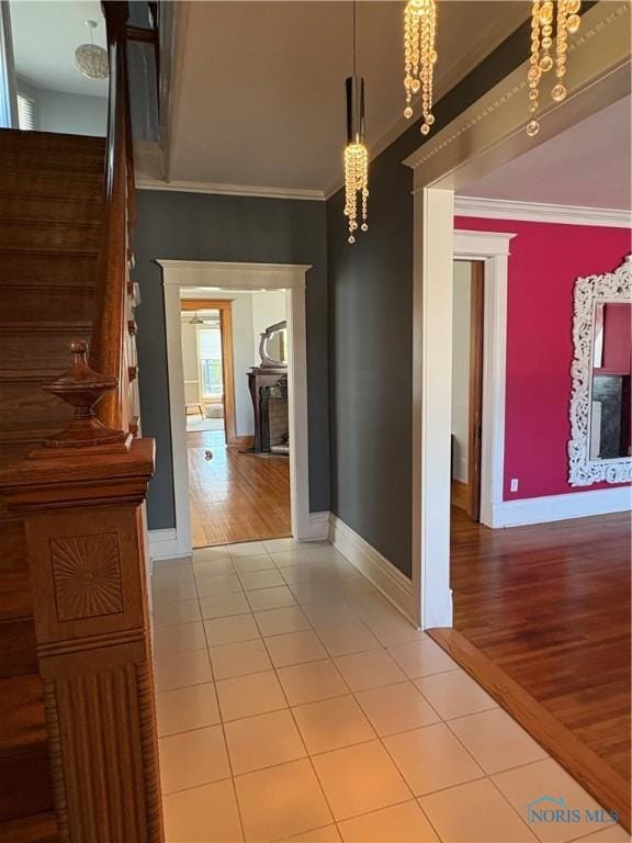 643 S Clinton St, Defiance, OH 43512 - corridor featuring ornamental molding, light tile patterned floors, and stairs