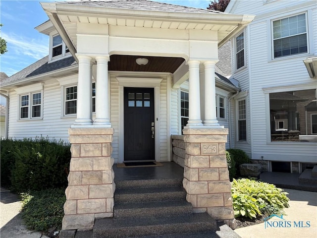 643 S Clinton St, Defiance, OH 43512 - view of exterior entry with a shingled roof