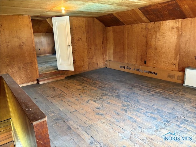 643 S Clinton St, Defiance, OH 43512 - additional living space with hardwood / wood-style flooring, lofted ceiling, wood ceiling, and wooden walls