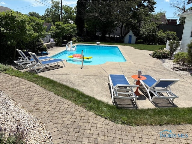 643 S Clinton St, Defiance, OH 43512 - swimming pool with a patio and a storage shed