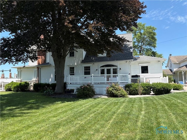643 S Clinton St, Defiance, OH 43512 - back of house featuring a lawn, a deck, and a shingled roof