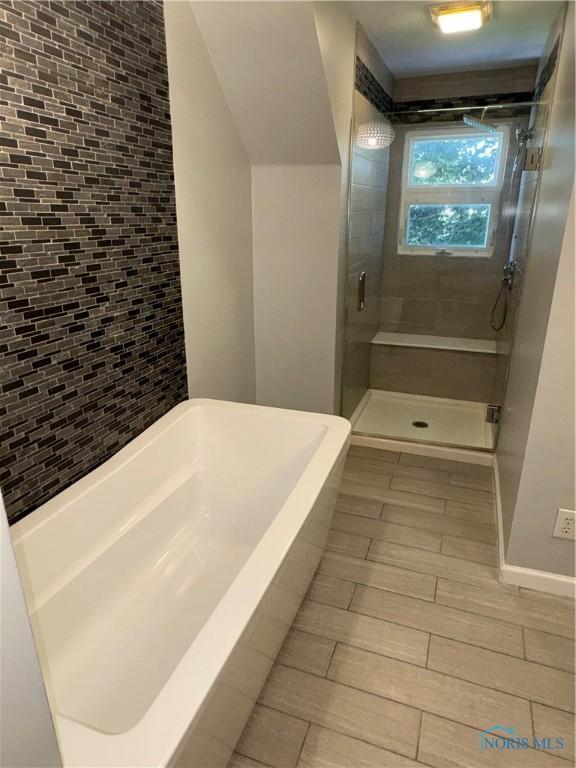 643 S Clinton St, Defiance, OH 43512 - full bath with a shower stall and a tub