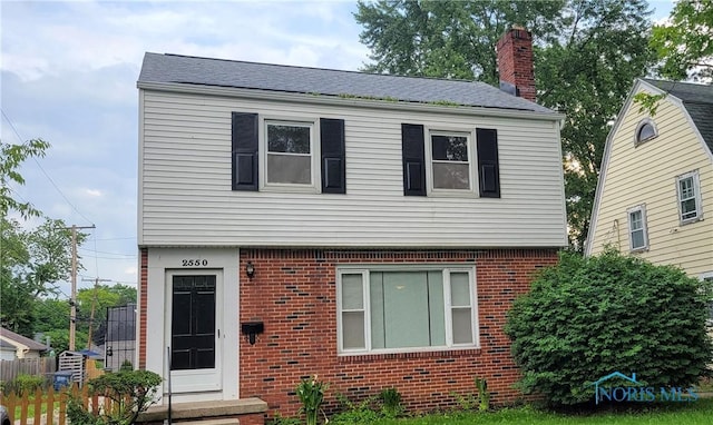 2550 Secor Rd, Toledo, OH 43606 - view of front facade featuring a chimney and brick siding