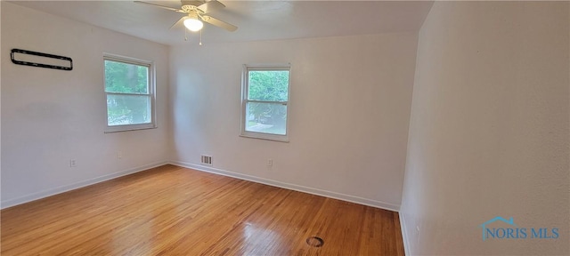 2550 Secor Rd, Toledo, OH 43606 - unfurnished room featuring healthy amount of natural light, light wood finished floors, and ceiling fan