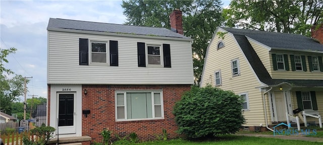 2550 Secor Rd, Toledo, OH 43606 - view of front of house with a chimney and brick siding