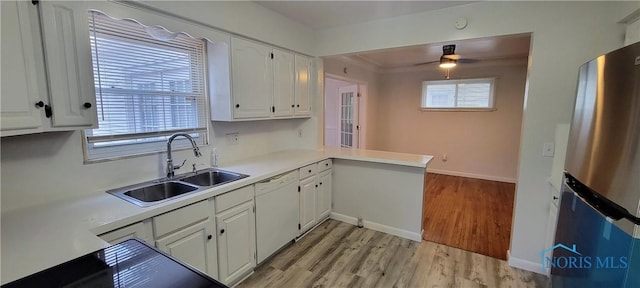 2550 Secor Rd, Toledo, OH 43606 - kitchen with freestanding refrigerator, dishwasher, white cabinetry, and light wood-type flooring