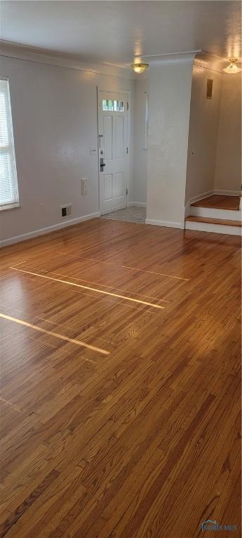 2550 Secor Rd, Toledo, OH 43606 - unfurnished living room with crown molding and wood finished floors