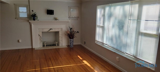 2550 Secor Rd, Toledo, OH 43606 - unfurnished living room featuring baseboards and wood finished floors