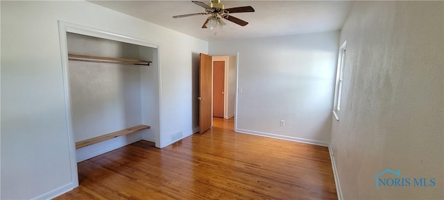 2550 Secor Rd, Toledo, OH 43606 - unfurnished bedroom with wood finished floors, a closet, and ceiling fan