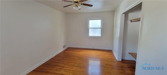 2550 Secor Rd, Toledo, OH 43606 - unfurnished bedroom with wood finished floors, a closet, and ceiling fan