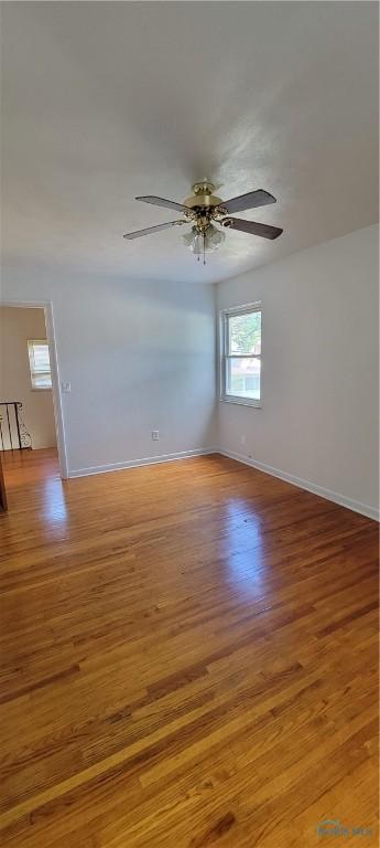 2550 Secor Rd, Toledo, OH 43606 - empty room with light wood-style floors and ceiling fan