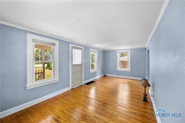 2825 N Mccord Rd, Toledo, OH 43615 - empty room with crown molding, plenty of natural light, and light wood finished floors