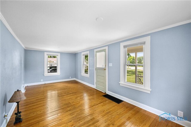 2825 N Mccord Rd, Toledo, OH 43615 - unfurnished room featuring crown molding, wood finished floors, and healthy amount of natural light