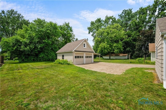 2825 N Mccord Rd, Toledo, OH 43615 - view of green lawn featuring a garage and an outbuilding