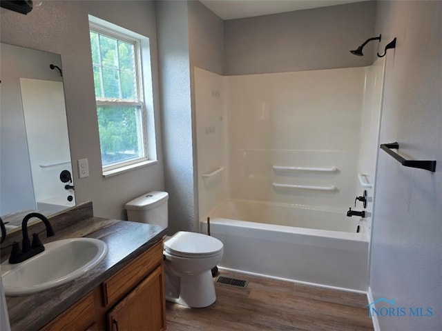 1311 Fitchland Ave, Toledo, OH 43606 - full bath featuring plenty of natural light, wood finished floors, vanity, and shower / bath combination