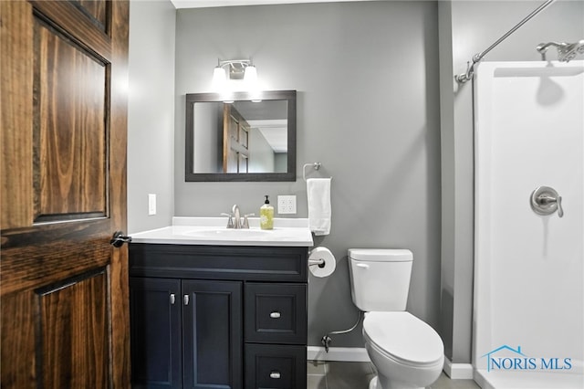 bathroom featuring a shower, vanity, and tile patterned floors