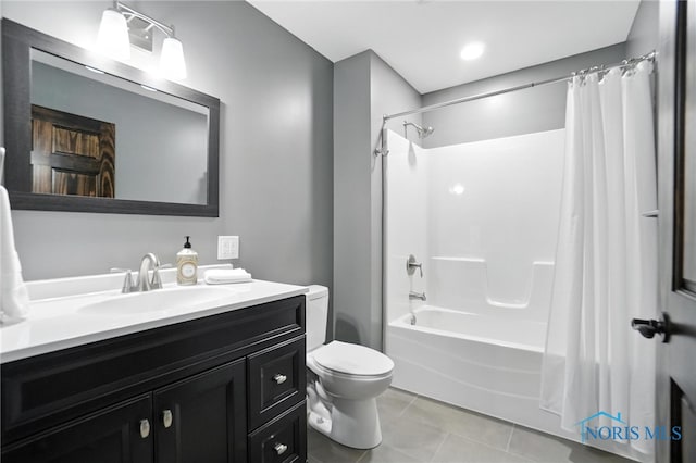 bathroom with vanity, shower / bath combo, and tile patterned flooring