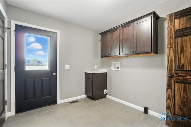 laundry room with washer hookup and cabinet space