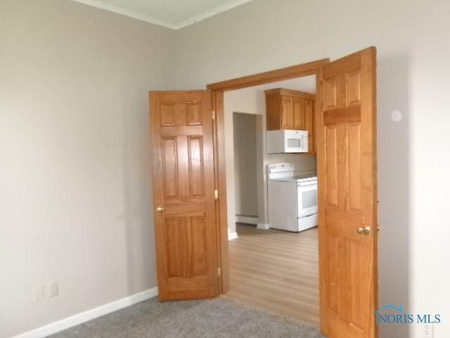 530 N Taft Ave, Ottawa, OH 45875 - empty room with ornamental molding and a baseboard heating unit