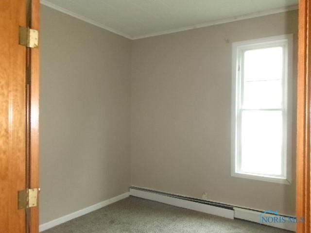 530 N Taft Ave, Ottawa, OH 45875 - empty room featuring crown molding, baseboard heating, and carpet floors
