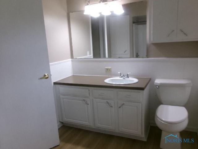 530 N Taft Ave, Ottawa, OH 45875 - half bathroom with vanity and wood finished floors