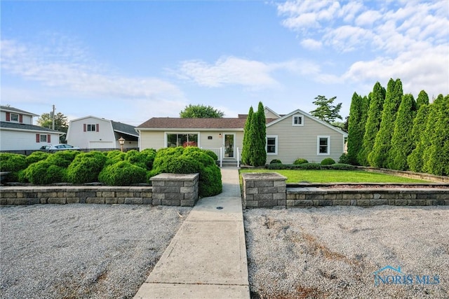 855 Strotz Dr, Toledo, OH 43612 - view of front of house featuring a front lawn