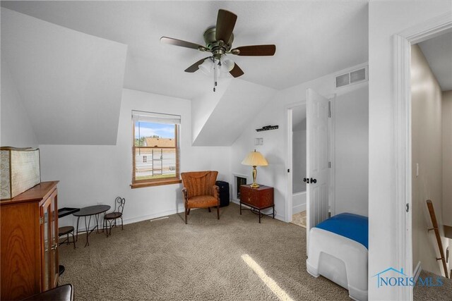 855 Strotz Dr, Toledo, OH 43612 - living area with carpet flooring, vaulted ceiling, and a ceiling fan