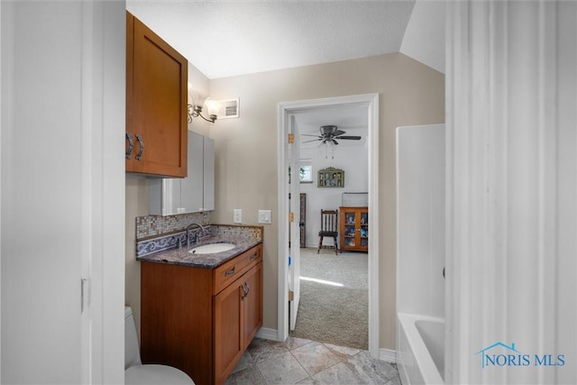 855 Strotz Dr, Toledo, OH 43612 - bathroom featuring vanity, decorative backsplash, a ceiling fan, tile patterned floors, and  shower combination