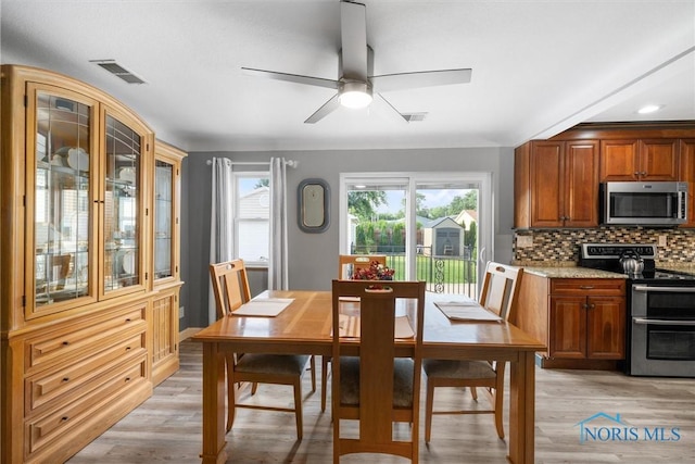 855 Strotz Dr, Toledo, OH 43612 - dining area with a ceiling fan and light wood-style flooring